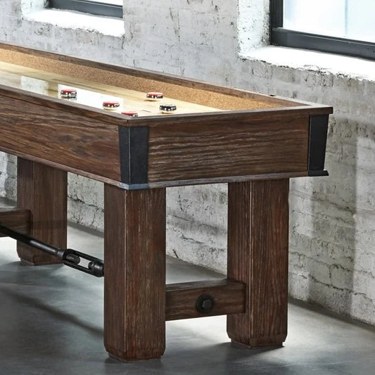 Brunswick Andover Chestnut Shuffleboard Table In a Room