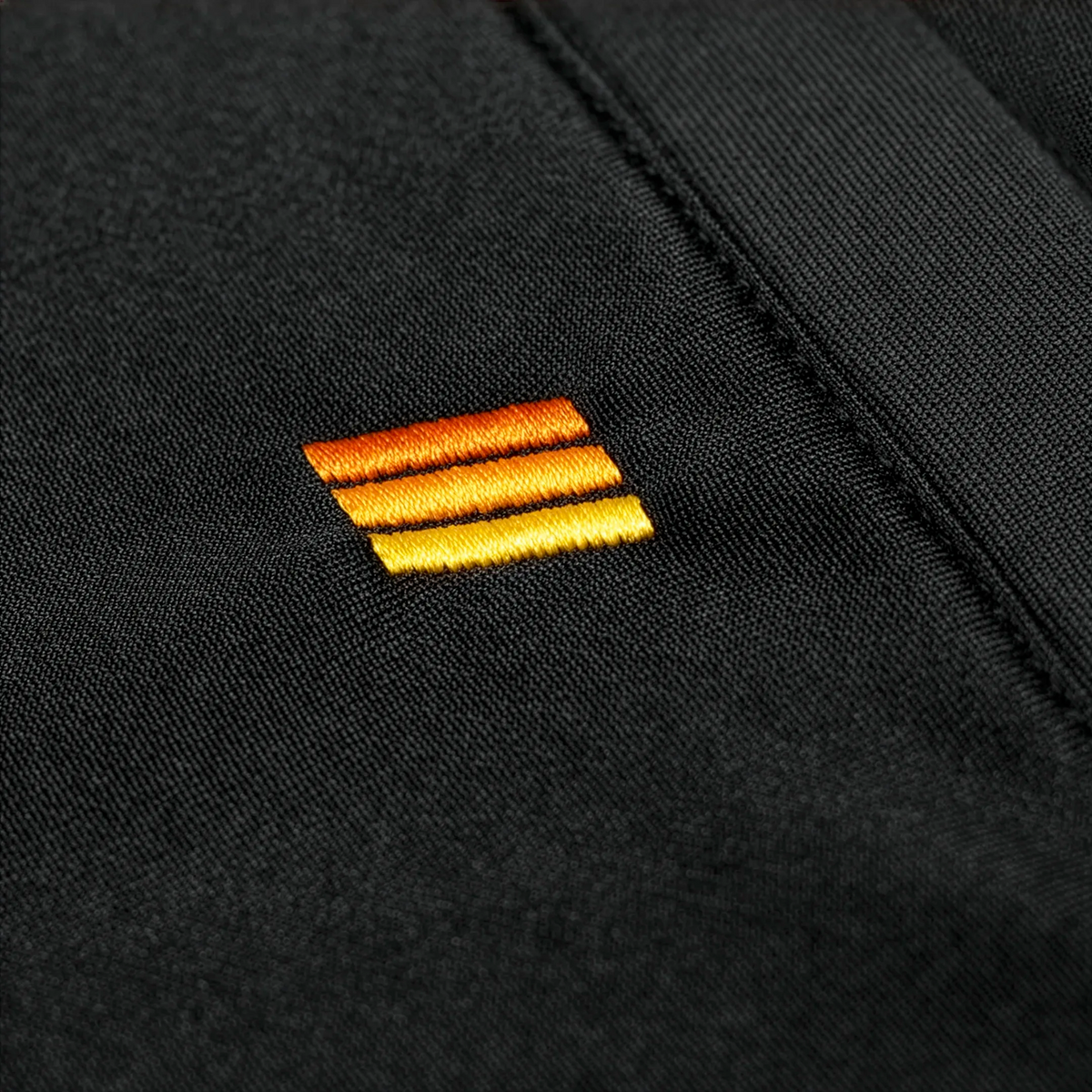 Black Jogger Pants Close Up on Embroidery