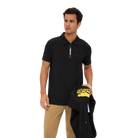Man wearing a black zipper polo shirt with Predator branding