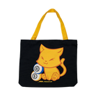 Black tote bag with a yellow cat design