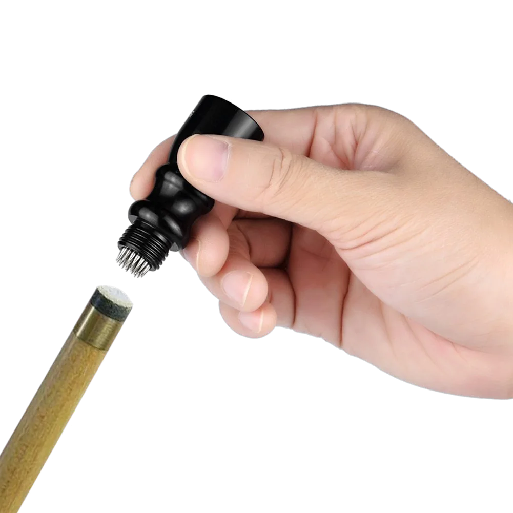 Hand Using a Black Cue Tip Tapper on a Cue Tip