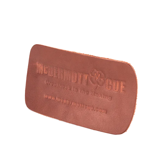McDermott Leather Shaft Conditioner Pad In Brown Leather Embossed With The McDermott Cue Clover