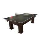 Brunswick Table Tennis Conversion Top With Net and Paddles on a Dark Wood Pool Table