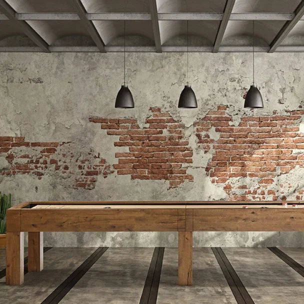 Brunswick Parsons 12 ft Shuffleboard in Natural Oak In a Room With a Brick Wall